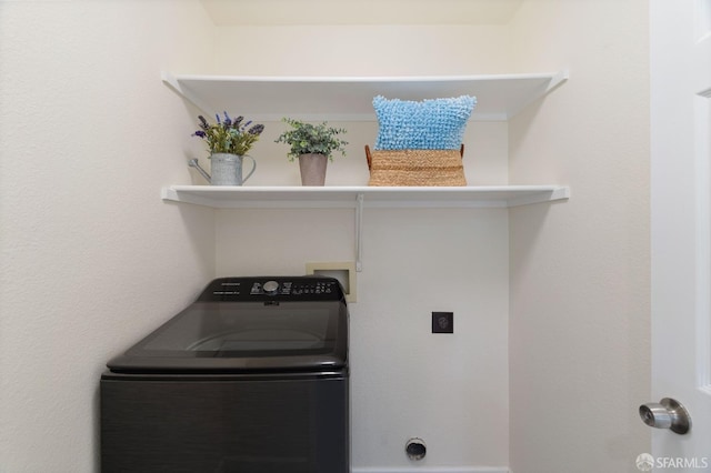 washroom featuring washer / clothes dryer and laundry area