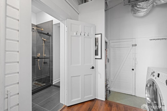 59 Octavia St, San Francisco, CA 94102 - laundry room featuring washer / dryer and dark wood-style floors