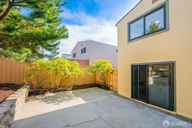 view of patio with fence