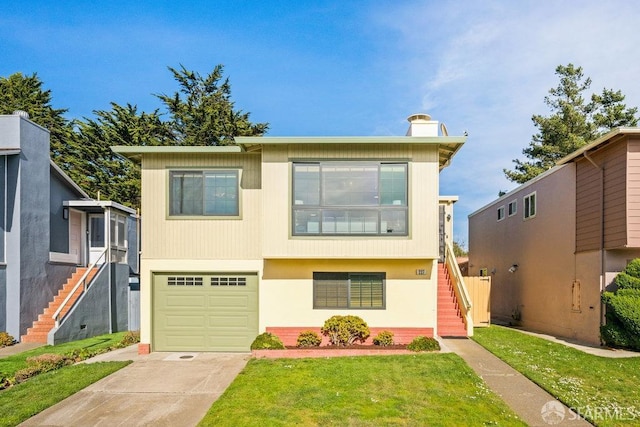 view of front of house featuring stairs, concrete driveway, a front yard, and a garage