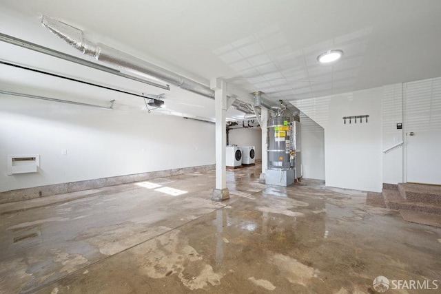 parking deck with washer and clothes dryer and a garage door opener