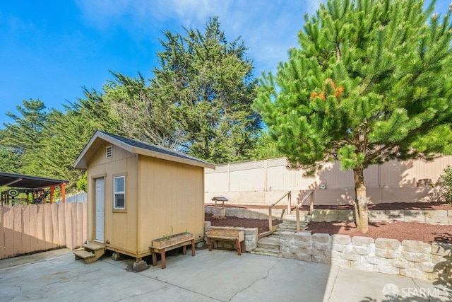 view of shed with a fenced backyard