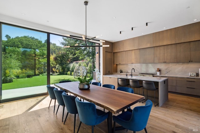 dining space featuring light wood finished floors