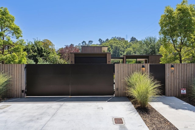 view of gate with fence