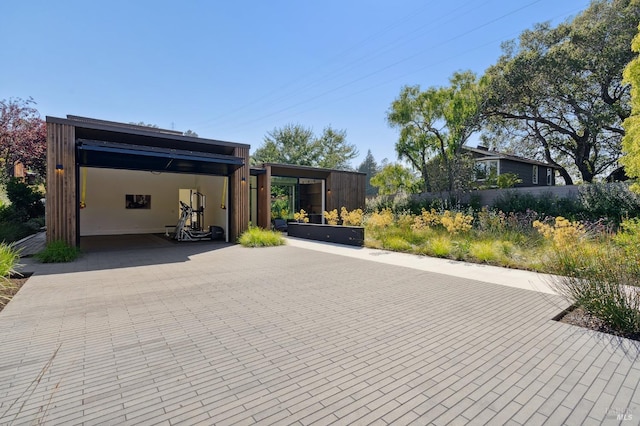 exterior space with decorative driveway