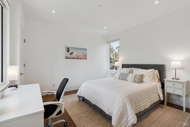 bedroom with recessed lighting, baseboards, and wood finished floors