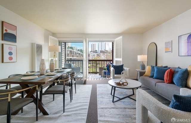 living area with a view of city and carpet flooring