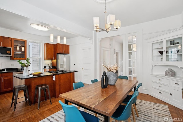 1483 Guerrero St, San Francisco, CA 94110 - dining area with a chandelier and dark wood finished floors