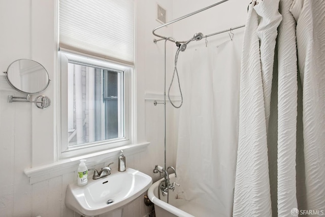 1483 Guerrero St, San Francisco, CA 94110 - bathroom with a sink and shower / tub combo with curtain