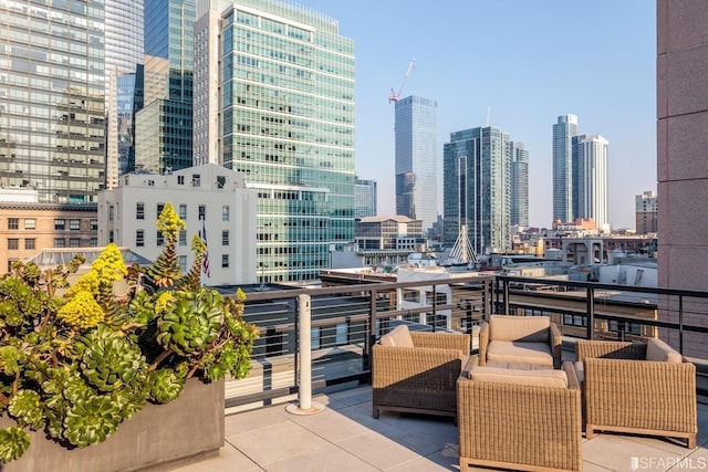 exterior space featuring an outdoor hangout area and a balcony