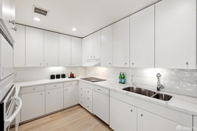 1333 Jones St Unit 508, San Francisco, CA 94109 - kitchen with dishwasher, a sink, tasteful backsplash, stainless steel oven, and light stone countertops