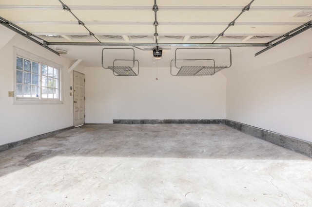 garage featuring baseboards and a garage door opener