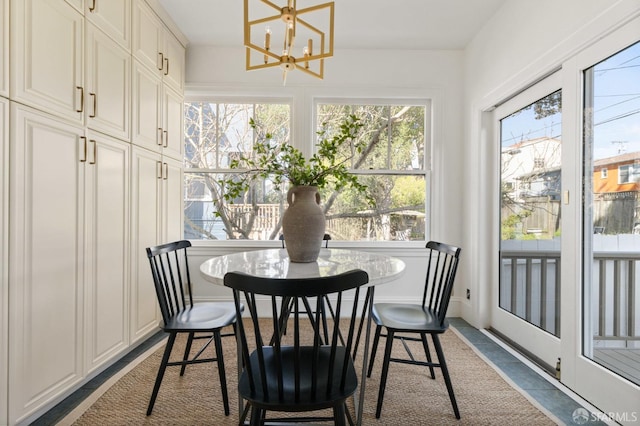 dining space with a chandelier