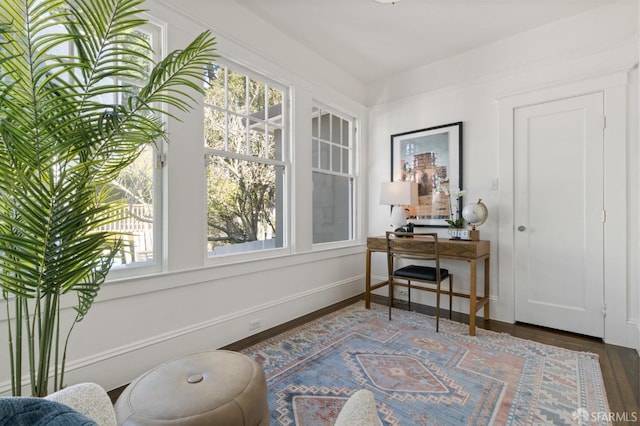 sitting room with wood finished floors and baseboards