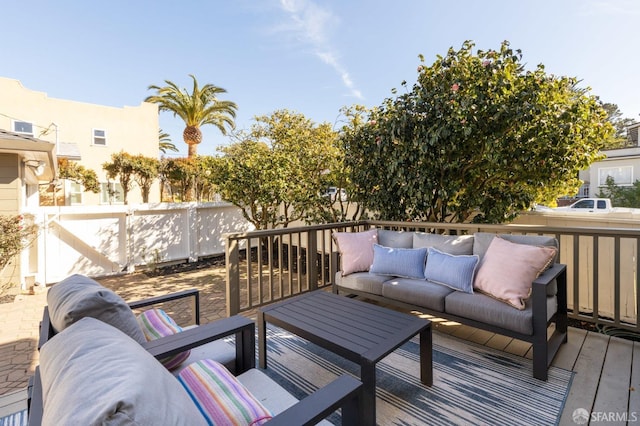 deck featuring fence and an outdoor hangout area