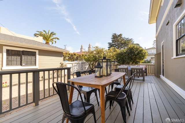 deck with outdoor dining space