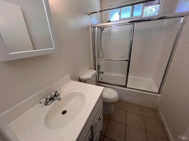 1080 Tijuana Ct, Santa Rosa, CA 95401 - bathroom featuring combined bath / shower with glass door, vanity, tile patterned flooring, and toilet