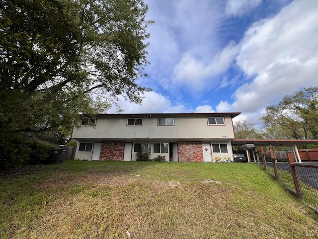 1080 Tijuana Ct, Santa Rosa, CA 95401 - back of house with a lawn, fence, and an attached carport