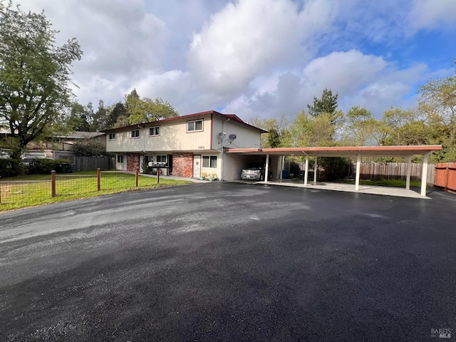 1080 Tijuana Ct, Santa Rosa, CA 95401 - exterior space featuring fence, aphalt driveway, brick siding, and a front yard