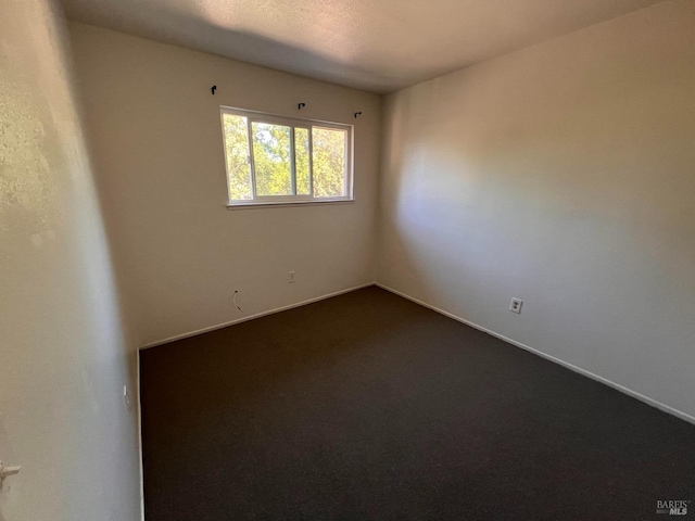 1080 Tijuana Ct, Santa Rosa, CA 95401 - empty room featuring dark carpet and baseboards