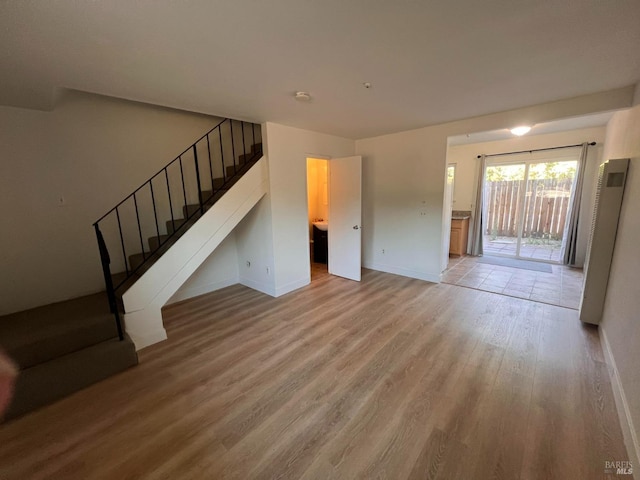 1080 Tijuana Ct, Santa Rosa, CA 95401 - unfurnished living room with baseboards, wood finished floors, and stairs