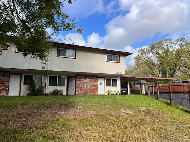1080 Tijuana Ct, Santa Rosa, CA 95401 - back of property with brick siding, a yard, and fence