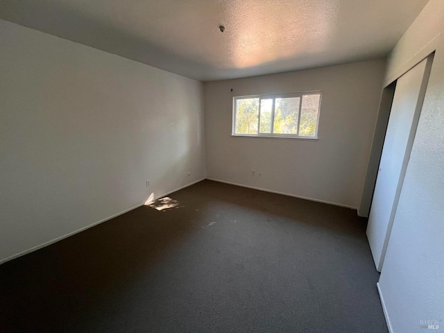 1080 Tijuana Ct, Santa Rosa, CA 95401 - unfurnished bedroom with dark carpet and baseboards