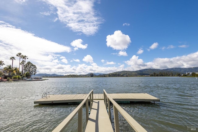 dock area with a water and mountain view