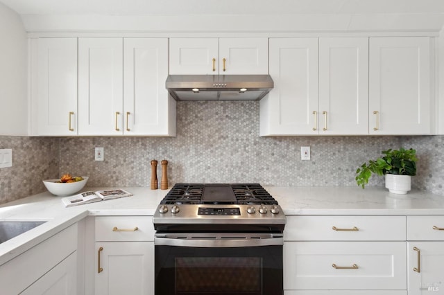 kitchen with decorative backsplash, under cabinet range hood, white cabinets, and stainless steel gas range