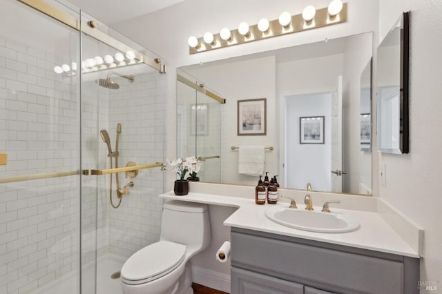 full bathroom featuring vanity, toilet, and a stall shower