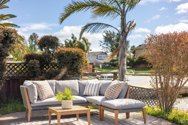 view of patio / terrace with an outdoor living space and fence