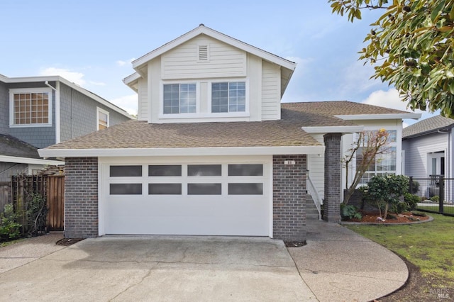 view of front facade featuring brick siding, driveway, and fence