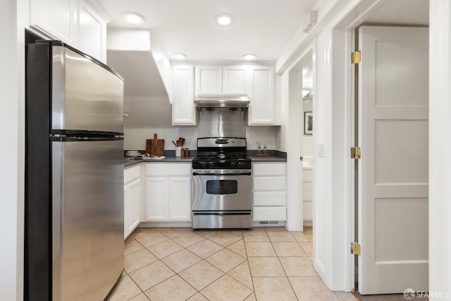 kitchen featuring white cabinetry, light tile patterned floors, and stainless steel appliances