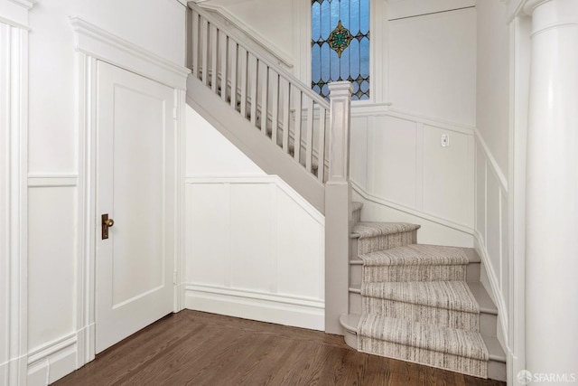 staircase with hardwood / wood-style floors