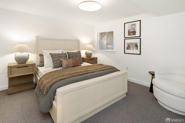 bedroom featuring dark colored carpet