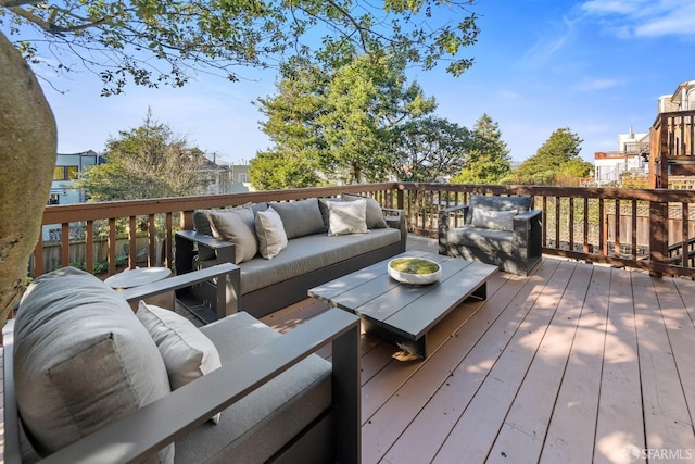 wooden terrace with outdoor lounge area