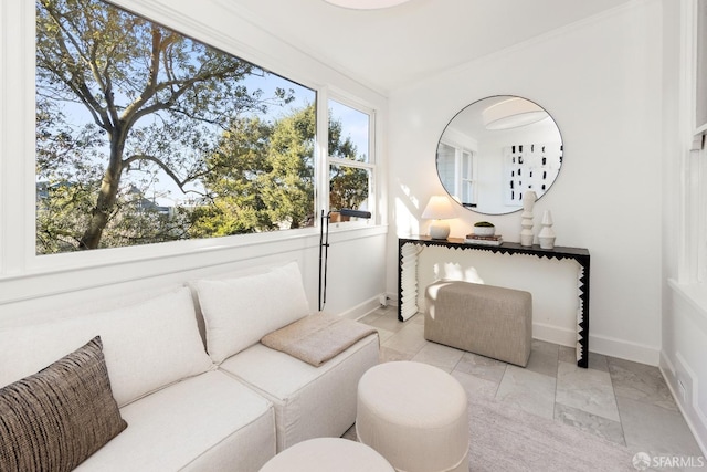 sitting room featuring crown molding