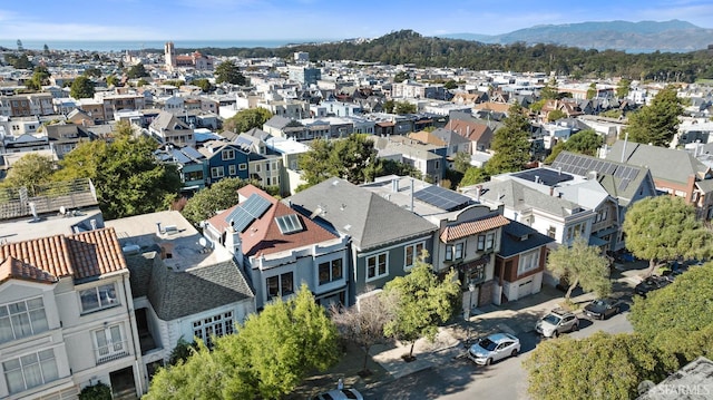 birds eye view of property with a mountain view