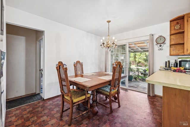 dining space featuring a chandelier