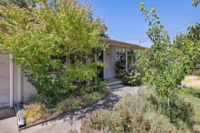 view of property hidden behind natural elements