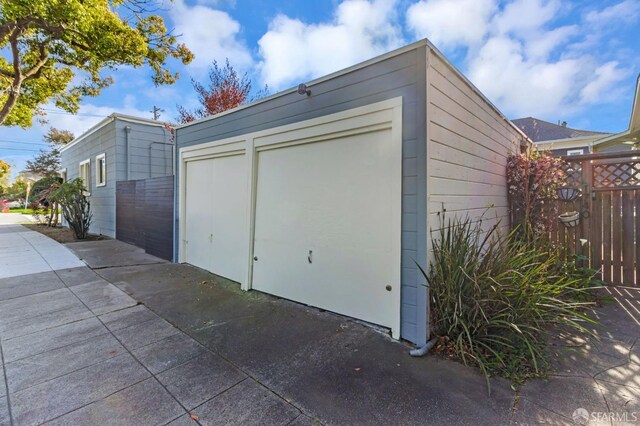 garage with fence