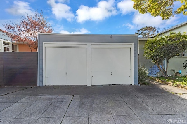 garage featuring fence