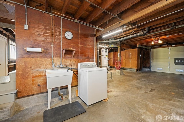 basement featuring washer / clothes dryer and water heater