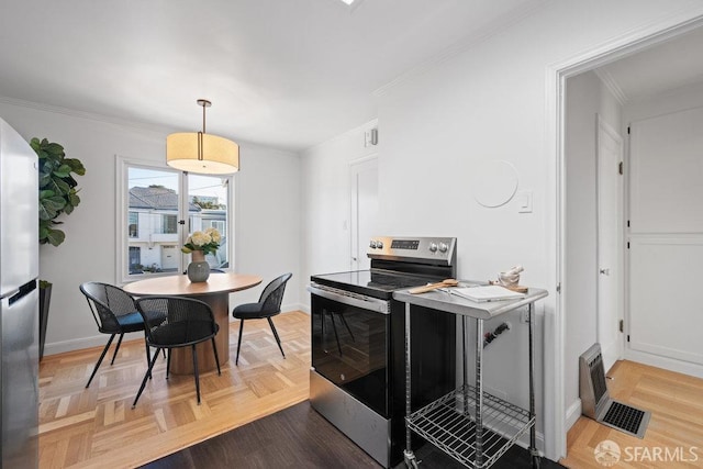 kitchen with stainless steel appliances, crown molding, parquet flooring, and decorative light fixtures