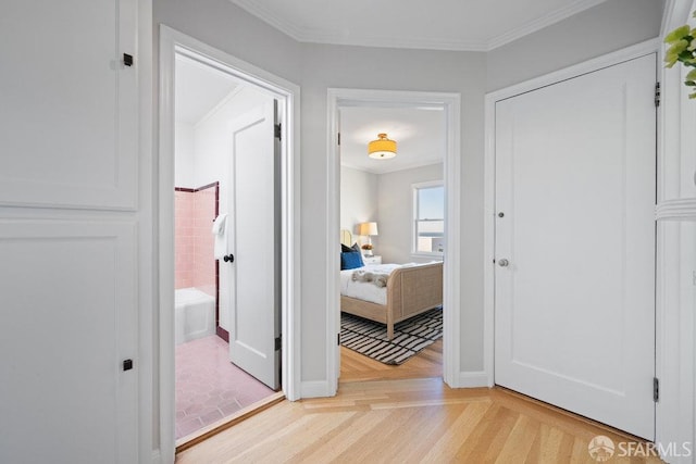 hall featuring crown molding and light parquet floors