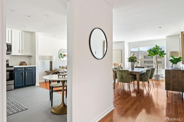 hall with light hardwood / wood-style floors