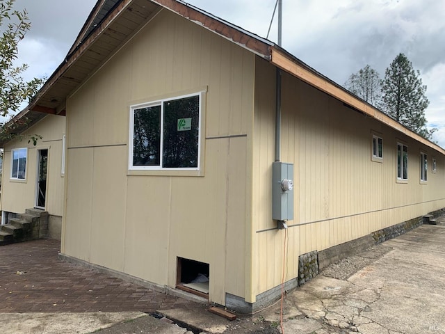 view of side of home with a patio