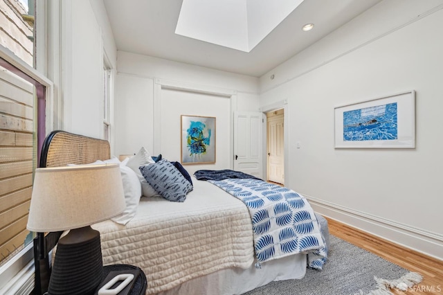 338 Scott St, San Francisco, CA 94117 - bedroom with a skylight, wood finished floors, recessed lighting, and baseboards