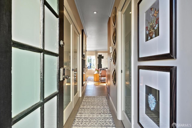 hallway featuring tile patterned flooring