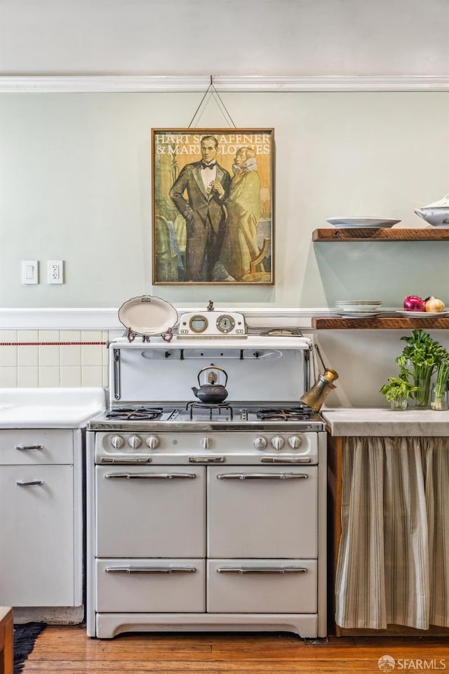 kitchen featuring light wood-type flooring and white range oven